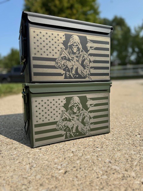 Black and green ammo cans engraved with a grim reaper and American flag