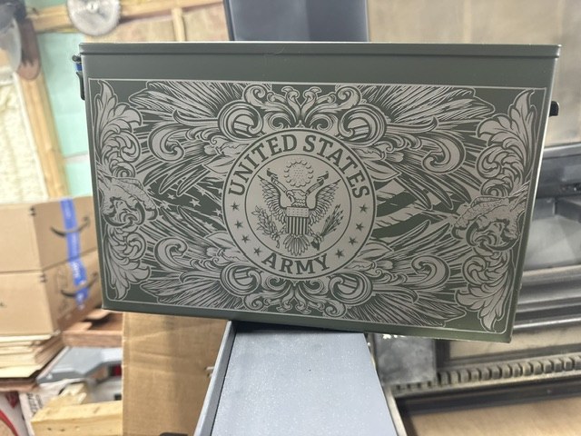 Green ammo can with an ornate United States Army seal engraving